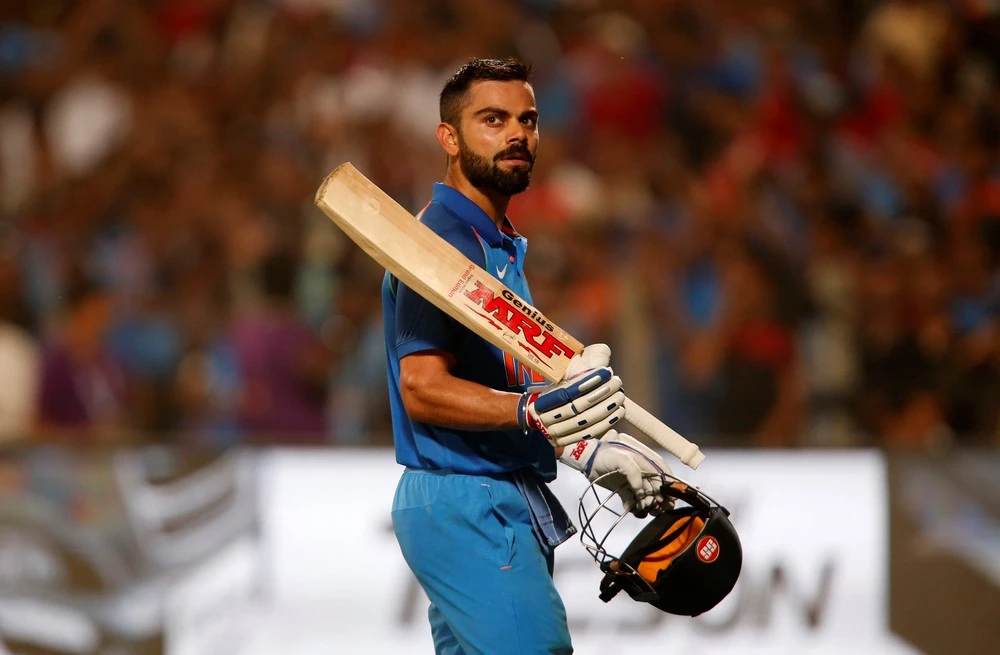 Virat Kohli celebrating a hundred with MRF bat – showcasing bat model